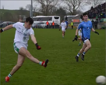  ??  ?? Wing-back Quinn Saunders in the process of hammering home his goal on the stroke of half-time.