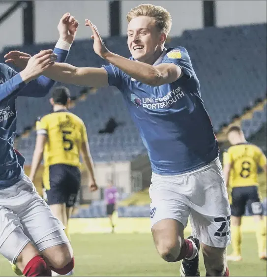  ?? Pictures: Jason Brown ?? White, right, celebrates with Ronan Curtis after scoring Pompey’s winning goal against Oxford United last night