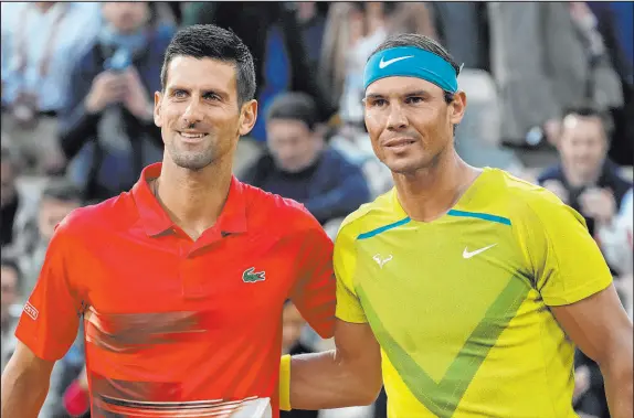  ?? Christophe Ena
The Associated Press ?? Serbia’s Novak Djokovic, left, looks to make a triumphant return Down Under, having won 30 of his past 31 tournament matches dating to last season. Spain’s Rafael Nadal, right, has won just one of his past seven matches. Nadal owns 22 major victories. Djokovic has 21.