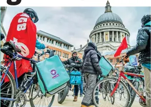  ??  ?? Protest: Riders outside the London Stock Exchange yesterday on Deliveroo’s first day of public trading