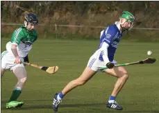  ??  ?? Cian Meyler of OLI/St. Fintan’s races away from James Boland.