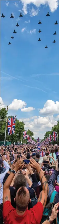  ?? ?? Seventy glorious years: RAF fighter jets soaring above the Mall in careful formation yesterday