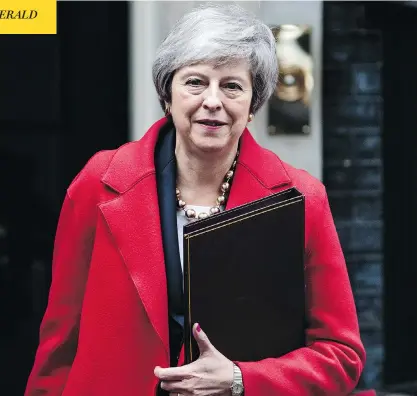  ?? JACK TAYLOR / GETTY IMAGES ?? British Prime Minister Theresa May leaves 10 Downing Street on Tuesday, as three successive failed votes put her plans for Brexit in danger and her position as party leader — and prime minister — on shakier ground.