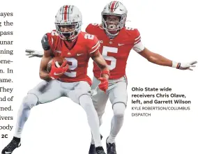  ?? KYLE ROBERTSON/COLUMBUS DISPATCH ?? Ohio State wide receivers Chris Olave, left, and Garrett Wilson