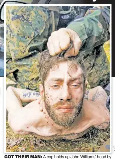  ??  ?? GOT THEIR MAN: A cop holds up John Williams’ head by his hair after his capture in Maine on Saturday, before he was led to a police car and taken to jail.