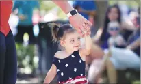  ?? Chris Kaufman/appeal-democrat ?? Heather Sheridan of Yuba City dances with her daughter, Savannah Vargas, 2, during the Fourth of July Children’s Parade in 2017 at the Yuba City Town Center.