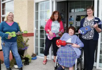  ?? Photo: Sheila Fitzgerald ?? Anna Collins of Kanturk Library presented 10 ukuleles to Kanturk Community Hospital residents as part of the Cork County Council Sound Initiative. Nora Scannell accepted on behalf of the residents, with staff members Ber O’Leary and Mary O’Connor also ready to strike up a tune!