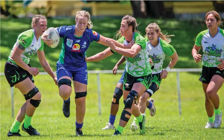  ?? Photo: Leon Lord ?? Rooster Chicken Fijiana Drua lock Jade Coates bursts through the Rhino Rugby Academy defence during their friendly encounter at Prince Charles Park, Nadi, on March 15, 2023. Fijiana Drua won 38-10. Coates is back from a leg injury that saw her missing out at last September’s Women’s Rugby World Cup in New Zealand.