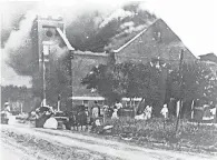  ??  ?? Mt. Zion Baptist Church in the Greenwood district was set afire by a white mob in 1921. GREENWOOD CULTURAL CENTER VIA TULSA WORLD/AP