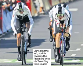  ??  ?? Chris Froome, left, sprints towards the finish line with his Team Sky team-mates