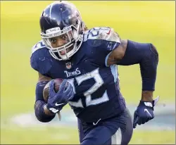  ?? Brett Carlsen / Associated Press ?? Titans running back Derrick Henry became the first back-to-back NFL rushing champion since Ladainian Tomlinson in 2006-07 with a career-high
2,027 yards this season. He ran for a career-best 250 yards last week as Tennessee clinched its first AFC South title since 2008 with a 41-38 victory over Houston.