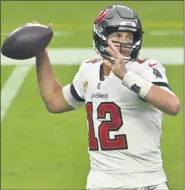  ?? DAVID BECKER — THE ASSOCIATED PRESS ?? Tampa Bay Buccaneers quarterbac­k Tom Brady throws against the Las Vegas Raiders during the first half of Sunday’s game in Las Vegas.