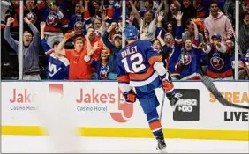  ?? Jim Mcisaac / Associated Press ?? Islanders center Josh Bailey celebrates his goal against the Lightning in the second period of Game 4 on Saturday night at Nassau Coliseum.