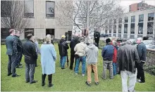  ?? CHERYL CLOCK THE ST. CATHARINES STANDARD ?? People gather in front of St. Catharines city hall for Day of Mourning ceremonies, Saturday.