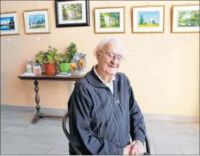  ?? ERIC BOURQUE ?? Father Maurice LeBlanc in the community centre at École secondaire de Par-en-Bas in Tusket, where he has paintings on display.