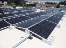  ?? Tyler Sizemore / Hearst Connecticu­t Media file photo ?? New solar panels are installed at DiMare Pastry Shop & Cafe in Stamford on July 21, 2020.