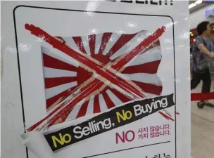  ?? AP ?? EXPORT SPAT: A notice urging a boycott of Japanese-made products is displayed Friday at a store in Seoul, South Korea, evidence of long fraught ties between the two nations.