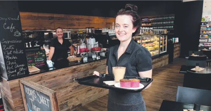  ?? Picture: STEWART McLEAN ?? HEALTHY MIX: Baristas Amy McCartney (left) and Anita Howard at the Pease St Discount Drug Store’s popular new Compound Cafe.