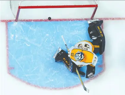  ?? JACK DEMPSEY/THE ASSOCIATED PRESS ?? Nashville Predators goaltender David Rittich lets the puck slip past him for a goal against the Colorado Avalanche during Game 1 of their first-round playoff series in Denver on Tuesday. Rittich went 6-3-4 with a 3.57 goals-against average this season.