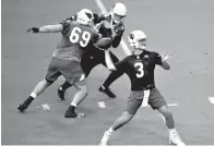  ?? Associated Press ?? ■ Arizona Cardinals quarterbac­k Josh Rosen (3) throws during the first day of NFL football training camp Saturday in Glendale, Ariz.