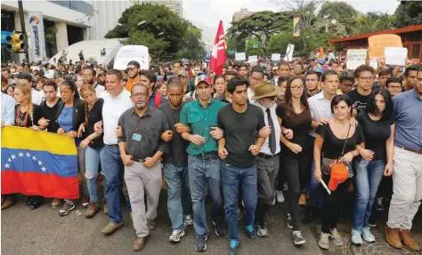  ?? — Reuters ?? Venezuela opposition leader and Governor of Miranda state Henrique Capriles attends a tribute to Juan Pablo Pernalete, who died after being hit by a tear gas shot during a protest against Venezuelan President Nicolas Maduro in Caracas.