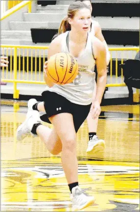  ?? MARK HUMPHREY ENTERPRISE-LEADER ?? Prairie Grove junior Ella Faulk pushes the basketball up the floor. The guard has a good all-around game averaging 6 points, nearly 3 rebounds, 2.4 assists, and 2.2 steals per game in the first five games of the 2021-2022 girls basketball season.