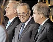  ?? ALASTAIR PIKE/GETTY-AFP ?? Sen. Chuck Schumer, center, said Republican leaders were violating the bipartisan spirit of July’s budget blueprint.