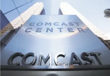  ?? Matt Rourke / Associated Press 2017 ?? As companies such as Comcast hand out bonuses, the Communicat­ions Workers of America has asked that workers get the $4,000 average income gain that White House officials said would flow from lower taxes.