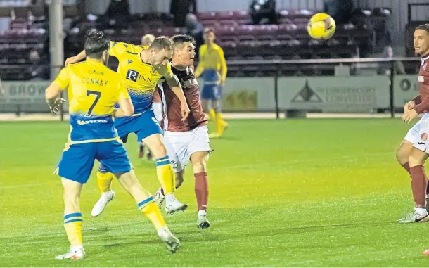  ??  ?? HEAD MAN: Chris Kane scores to put St Johnstone two ahead against Lowland League outfit Kelty Hearts.