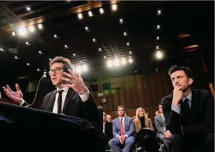  ?? Photos by Andrew Harnik / Associated Press ?? Bandmate Jordan Cohen, right, listens as singer-songwriter Clyde Lawrence, left, testifies before a Senate Judiciary Committee hearing to examine promoting competitio­n and protecting consumers in live entertainm­ent on Capitol Hill in Washington on Tuesday.