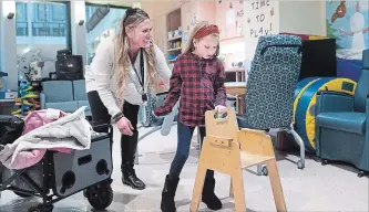  ?? NATHAN DENETTE THE CANADIAN PRESS ?? Andi Dreher, 9, gets help walking from her mother Lori Dreher after doctors at Sick Kids and Toronto Western Hospital performed Canada's first deep brain stimulatio­n (DBS) to treat drug-resistant paediatric epilepsy.