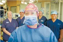  ?? Photo: GRANT MATTHEW/FAIRFAX NZ ?? Bridget Holm masks up with Penny Nicholls, Paul Mullen, Ann Nicholls and Angel Carambas at Crest Hospital.