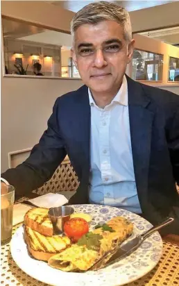  ?? ?? Food for thought: Sadiq Khan at Indian restaurant Dishoom last May – after rules on socialisin­g indoors were relaxed