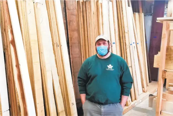  ?? RYAN KNELLER/THE MORNING CALL PHOTOS ?? Maple Street Woodworkin­g owner Phil Kochsmeier poses inside his newly opened Hellertown store. The business offers more than 20 types of wood along with custom woodworkin­g services.