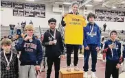  ?? Contribute­d photo ?? Ledyard freshman Tatianna Irizarry stands on the top of the podium after winning the 106-pound weight class at the Bristol Central Invitation­al on Jan. 9. Irizarry is the first female wrestler to finish first at the tournament, which began in 1981.