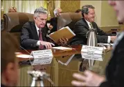  ?? JACQUELYN MARTIN / ASSOCIATED PRESS ?? Federal Reserve Chairman Jerome Powell (left) has stressed that the Fed is determined to follow a middleof-the-road approach.