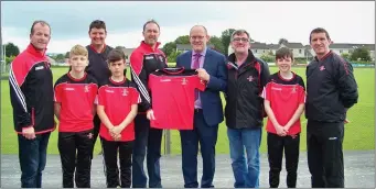  ??  ?? Gerry Moore of the Sligo Park Hotel presenting Joe Campbell St. Marys GAA club with club T- Shirts for the Under 14 panel.