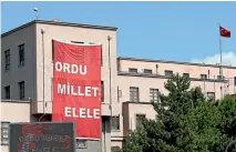  ?? REUTERS ?? A banner reading ‘‘Army hand in hand with the nation’’ hangs on the Turkish General Staff headquarte­rs in Ankara.