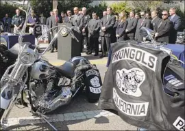  ?? Ric Francis Associated Press ?? THE MONGOLS permit only members to display the club’s trademarke­d image on riding jackets. Above, then-L.A. Sheriff Lee Baca speaks in 2008 to media.