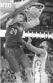  ?? PHELAN M. EBENHACK/ASSOCIATED PRESS ?? Magic rookie Khem Birch dunks over Cavs C Tristan Thompson during the second half of Tuesday’s game.