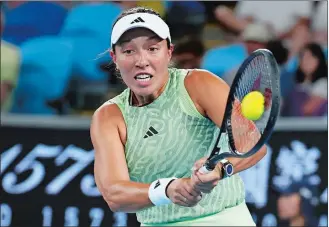  ?? ASANKA BRENDON RATNAYAKE/AP PHOTO ?? Jessica Pegula of the U.S. plays a backhand return to Rebecca Marino of Canada during their first round match at the Australian Open on Tuesday at Melbourne Park, Melbourne, Australia.