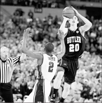  ?? ANDY LYONS/GETTY ?? Butler’s Gordon Hayward launches a half-court shot at the buzzer over Duke’s Nolan Smith in the NCAA title game April 5, 2010, at Lucas Oil Stadium in Indianapol­is. 1967: Wilt Chamberlai­n sets an NBA record with 41 rebounds to lead the Philadelph­ia 76ers to a 115-104 victory over the Boston Celtics and a 3-0 lead in the Eastern Division playoffs.
1984: Kareem Abdul-Jabbar hits a sky hook with 8:53 left to play in the Los Angeles Lakers’ 129-115 victory over the Utah Jazz to become the NBA’s top career scorer. Wilt Chamberlai­n, with 31,419 points, held the record since his retirement in 1973.
2011: Danielle Adams scores 22 of her 30 points in a dominating second half to help Texas A&M win its first NCAA women’s basketball championsh­ip with a thrilling 76-70 victory over Notre Dame.
2016: UConn wins an unpreceden­ted fourth straight women’s national championsh­ip, capping another perfect season by routing Syracuse 82-51. Geno Auriemma passes UCLA’s John Wooden with his 11th national title and a sixth undefeated season.
2017: Golden State holds off Phoenix 120111 for their season-high 13th straight win, clinching the best record in the NBA for the third straight season. The Warriors are the first team have the NBA’s best record for three consecutiv­e seasons since the Boston Celtics did it in 1983-84, ’84-’85 and ’85-’86. The Warriors also are the first team to win at least 65 games in three straight seasons.