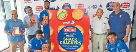  ?? Picture: REINAL CHAND ?? Punjas Group Directors Chetan Punja (left), Pravish Punja, Fijian Drua player Emosi Tuqiri, Senior Director Kanti Punja, Managing Director Rajesh Punja, Fijian Drua players Waqa Nalaqa (sitting left) and Philip Baselala at the launch of the new biscuit product at the Punjas Biscuit Factory in Navutu, Lautoka.