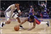  ?? CARLOS OSORIO — THE ASSOCIATED PRESS ?? Detroit Pistons guard Langston Galloway, right, and Sacramento Kings guard Kent Bazemore chase a loose ball during the first half Wednesday.