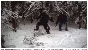  ?? (AP/United States Border Patrol Swanton sector) ?? Two individual­s shown on surveillan­ce camera footage illegally cross the U.S.-Canada border during January 2023 in the Vermont, New Hampshire and New York enforcemen­t sector.