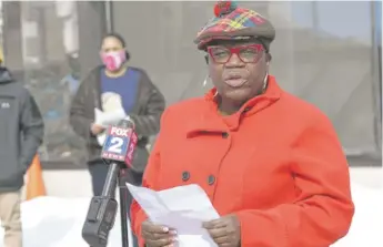  ?? CLARENCE TABB, JR./DETROIT NEWS VIA AP ?? JeDonna Matthews Dinges speaks Feb. 21 in Grosse Pointe Park, Michigan, about a white neighbor’s display of a Ku Klux Klan flag in a side window facing her home.