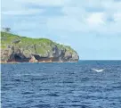  ?? RICHARD SIDEY/GALAXIID VIA AP ?? A tail of a humpback whale breaks the water in Niue. The tiny Pacific island nation has a new plan to protect its territoria­l waters – it will get sponsors to pay.
