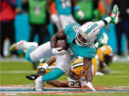  ?? MEGAN BRIGGS/GETTY IMAGES ?? Tyreek Hill has 113 receptions for 1,632 yards — both career highs already — in his first season with the Dolphins.