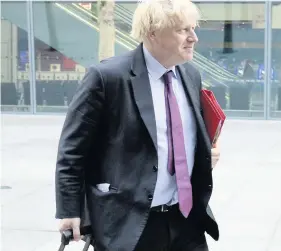  ??  ?? Boris Johnson MP arrives at Heathrow after a brief visit to Afghanista­n meant he missed the parliament­ary vote on the airport’s expansion