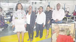  ?? (Pics: Mfanukhona Nkambule) ?? (L-R) Carol Mziyako on the far left with her management team, Mphumi Gumbi, the Coordinato­r, Thobile Fakudze the Production Manager, Buhle Mvila the Human Resources Manager and Rosewell Mziyako the General Manager. (INSET) At the textile and apparel factory, Buhle Mvila displaying one of the workwear that are produced by employees from Mtfombeni Investment in Big Bend.